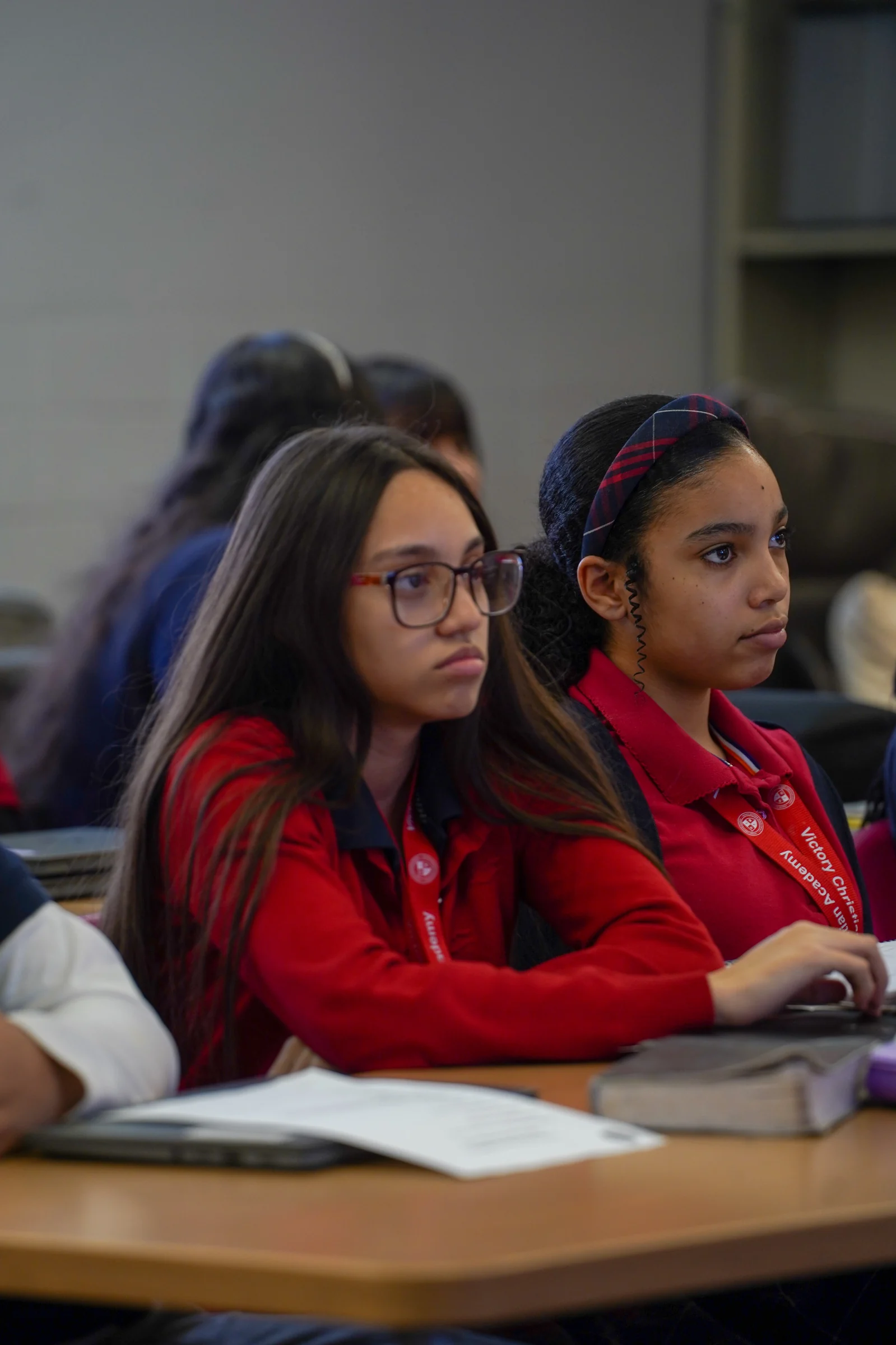 VCA students with Bibles open on their desks during class